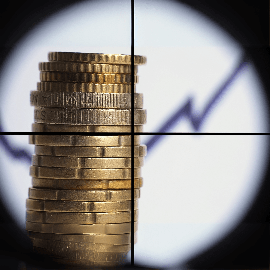 Picture of a stack of coins and a graph showing growth seen through the scope of sniper's rifle.