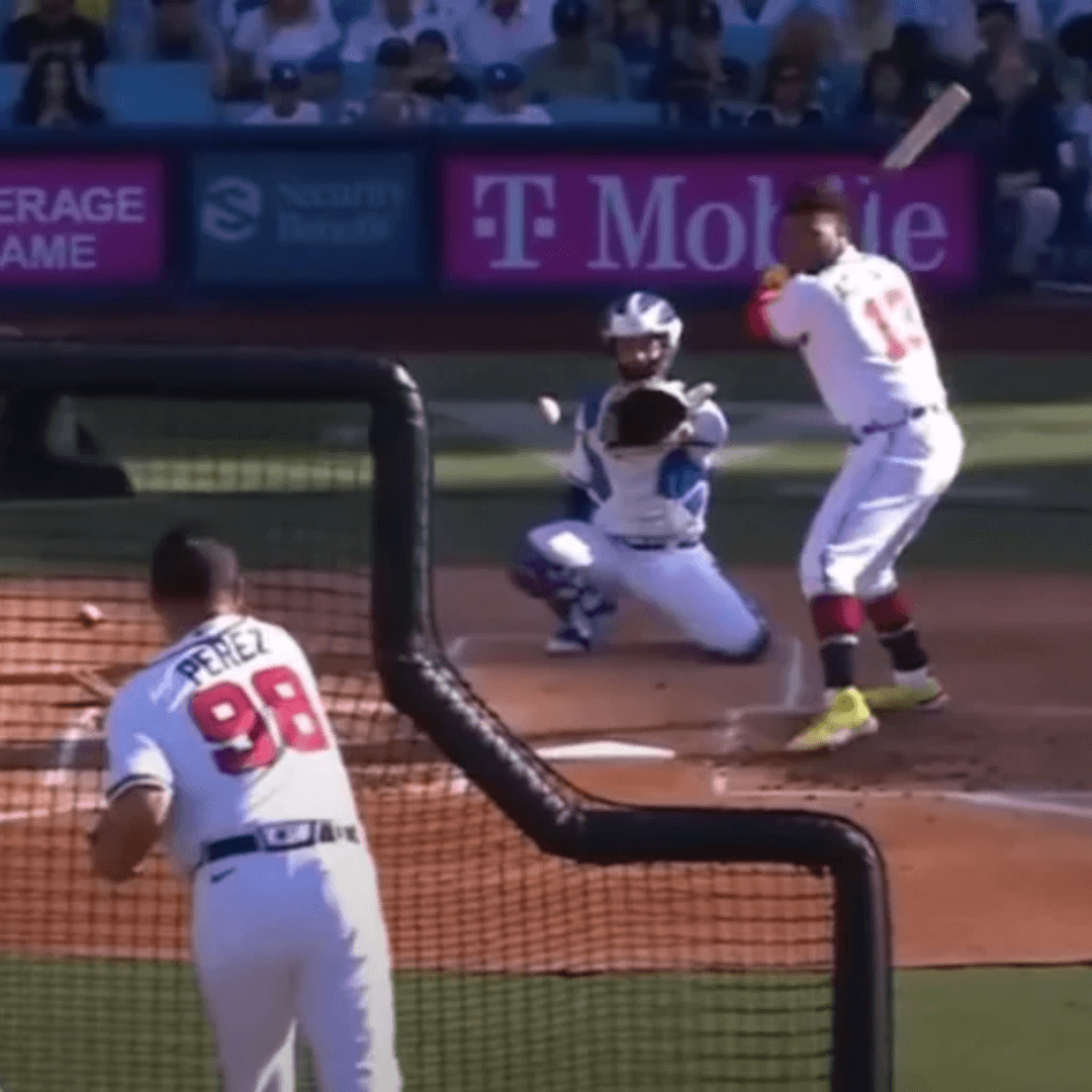 Picture of a pitcher in the home run derby in baseball delivering a hittable pitch to his pitcher.